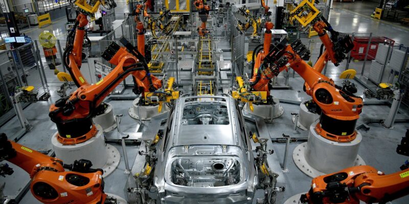 FILE PHOTO: Autonomous robots assemble an X model SUV at the BMW manufacturing facility in Greer, South Carolina, U.S. November 4, 2019.  REUTERS/Charles Mostoller/File Photo